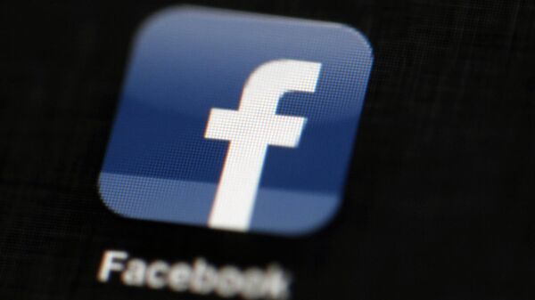 The Facebook logo is displayed on an iPad in Philadelphia, May 16, 2012 - Sputnik Africa