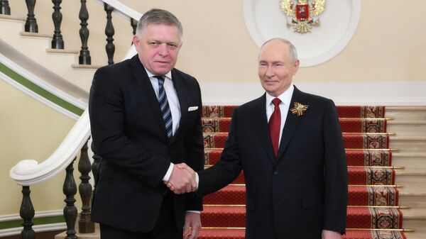 May 9, 2026. Russian President Vladimir Putin meets with Slovak Prime Minister Robert Fico (left) in the Kremlin on Victory Day. - Sputnik Africa