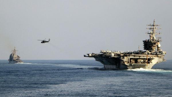 The aircraft carrier USS Dwight D. Eisenhower and other warships crosses the Strait of Hormuz into the Persian Gulf on Sunday. File photo. - Sputnik Africa