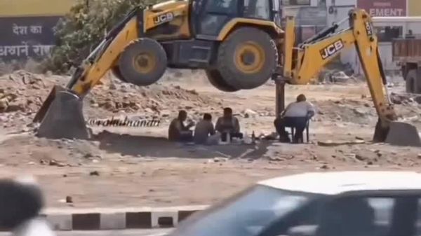 This is Peak Recklessness (or Chill): Lunch Break Under Machine Held Up by Nothing but Hydraulics - Sputnik Africa