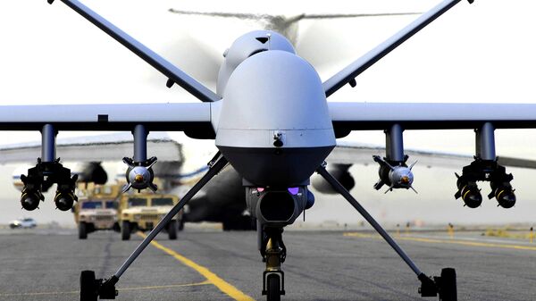 A fully armed MQ-9 Reaper unmanned aerial vehicle taxis down the runway at an air base in Afghanistan on its way to a wartime mission, May 4, 2008 - Sputnik Afrique