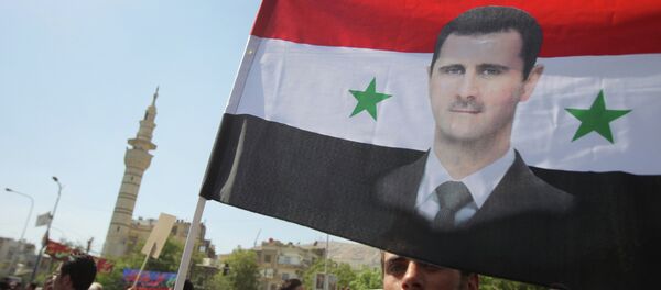 Митинг в поддержку Башара Асада в Дамаске - Sputnik Afrique