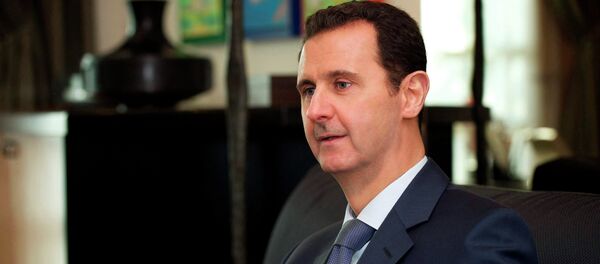 Syria's President Bashar al-Assad is seen during an interview with the American magazine Foreign Affairs published in Damascus January 26, 2015. - Sputnik Afrique