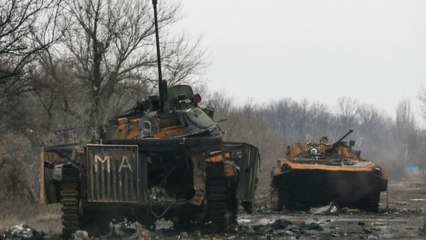 Armoured vehicles, destroyed during battles between the armed forces of the separatist self-proclaimed Donetsk People's Republic and the Ukrainian armed forces, are seen in Vuhlehirsk February 6, 2015 - Sputnik Afrique