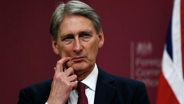 Britain's Foreign Secretary Philip Hammond gestures during a press conference at the Foreign and Commonwealth Office in London - Sputnik Afrique