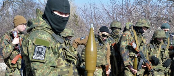 Fighters of Ukrainian volonteer Azov battalion take part in military exercises not far southeastern Ukrainian city of Mariupol, on February 27, 2015 - Sputnik Afrique