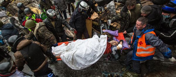 Manifestante herido en la Plaza de la Independencia (Maidán) de Kiev - Sputnik Afrique