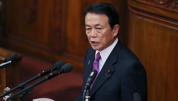 Japan's Finance Minister Taro Aso speaks during a opening session at the lower house of Parliament in Tokyo, Monday, Jan. 26, 2015 - Sputnik Afrique