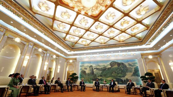 China's President Xi Jinping (4th R) meets with the guests at the Asian Infrastructure Investment Bank (AIIB) launch ceremony at the Great Hall of the People in Beijing in this October 24, 2014 - Sputnik Afrique