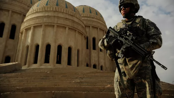 Army Spc. Michael McMiller, 3rd Squadron, 3rd Armored Cavalry Regiment, meets with an Iraqi Army unit at the Saddam Mosque prior to conducting a joint operation patrol in Al Zarai, Iraq, Oct. 30, 2008. - Sputnik Afrique