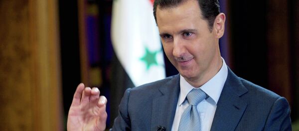 In this photo released on Tuesday, Feb. 10, 2015 by the Syrian official news agency SANA, Syrian President Bashar Assad gestures during an interview with the BBC, in Damascus, Syria. - Sputnik Afrique