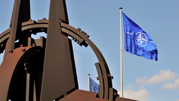 NATO flag in the wind at the NATO headquarters in Brussels - Sputnik Afrique
