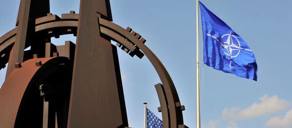 NATO flag in the wind at the NATO headquarters in Brussels - Sputnik Afrique