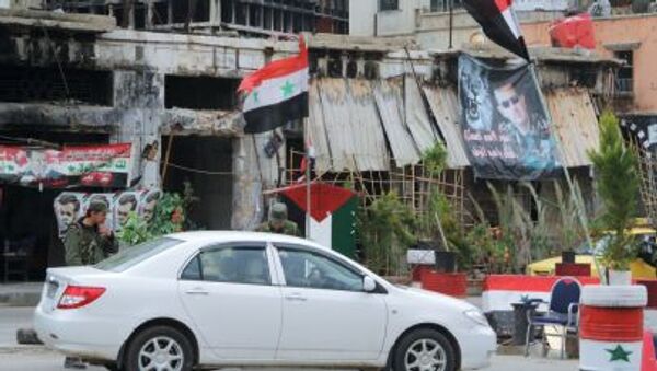 Un puesto de control del Ejército sirio en el centro de Homs - Sputnik Afrique