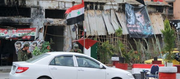 Un puesto de control del Ejército sirio en el centro de Homs - Sputnik Afrique