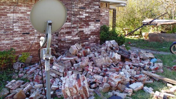 A damage home in central Oklahoma from the magnitude 5.6 earthquake on Nov. 6, 2011. - Sputnik Afrique