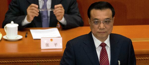 Chinese Premier Li Keqiang delivers the work report during the opening session of the National People's Congress at the Great Hall of the People in Beijing, Thursday, March 5, 2015 - Sputnik Afrique
