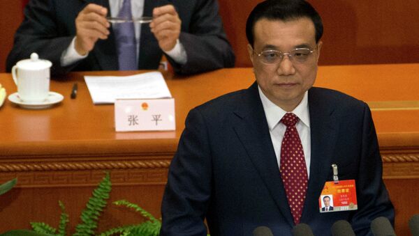 Chinese Premier Li Keqiang delivers the work report during the opening session of the National People's Congress at the Great Hall of the People in Beijing, Thursday, March 5, 2015 - Sputnik Afrique