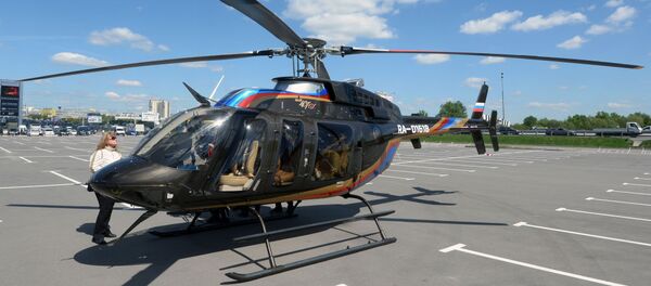 Вертолет Bell 407 GX прибывает для участия в выставке вертолетной индустрии HeliRussia 2015 в Москве - Sputnik Afrique