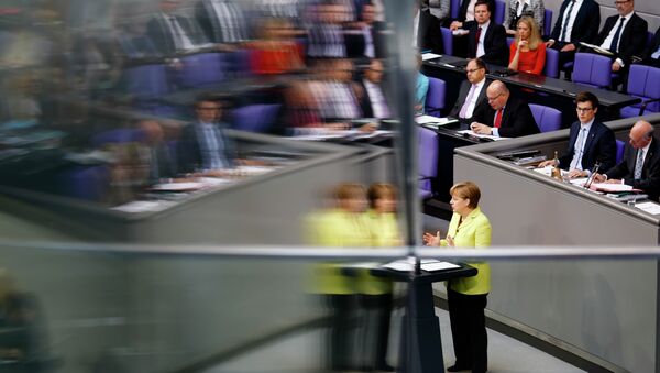 Angela Merkel is reflected in a window pane as she delivers a government declaration about the European Union and an Eastern Partnership with former Soviet Republics at the German parliament Bundestag in Berlin, Germany, Thursday, May 21, 2015. - Sputnik Afrique