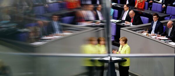 Angela Merkel is reflected in a window pane as she delivers a government declaration about the European Union and an Eastern Partnership with former Soviet Republics at the German parliament Bundestag in Berlin, Germany, Thursday, May 21, 2015. - Sputnik Afrique