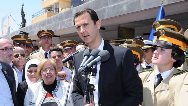 President Bashar al-Assad addresses his supporters at a school in an undisclosed location during an event to commemorate Syria's Martyrs' Day May 6, 2015 in this handout provided by SANA. - Sputnik Afrique