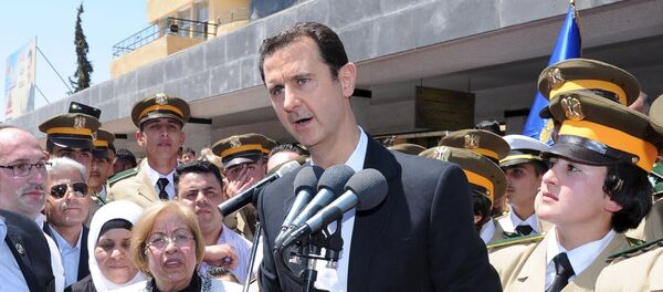 President Bashar al-Assad addresses his supporters at a school in an undisclosed location during an event to commemorate Syria's Martyrs' Day May 6, 2015 in this handout provided by SANA. - Sputnik Afrique