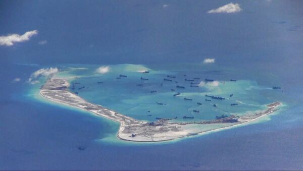 Chinese dredging vessels are purportedly seen in the waters around Mischief Reef in the disputed Spratly Islands, image from video taken by a P-8A Poseidon - Sputnik Afrique