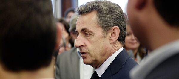 President of the French right-wing UMP party, Nicolas Sarkozy, leaves after voting at the party's headquarters in Paris, on May 28, 2015 - Sputnik Afrique