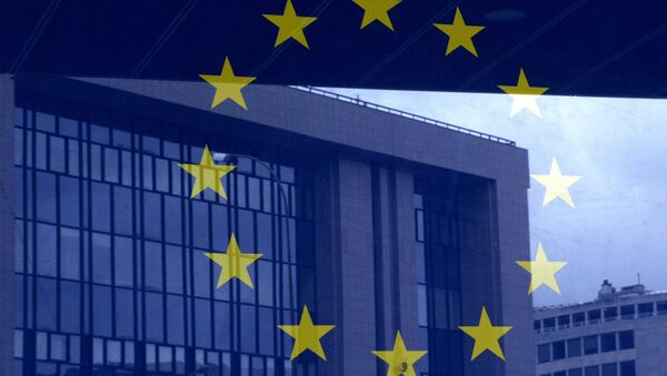 European Council building is reflected in a photograph of the EU flag on the wall of the European Council building, in Brussels - Sputnik Afrique
