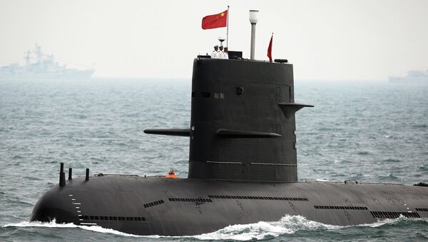 A Chinese Navy submarine attends an international fleet review to celebrate the 60th anniversary of the founding of the People's Liberation Army Navy on April 23, 2009 off Qingdao in Shandong Province - Sputnik Afrique
