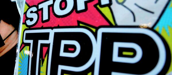 A placard during a rally against the Trans-Pacific Partnership (TPP) - Sputnik Afrique