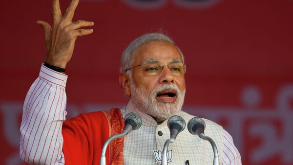 Indian Prime Minister Narendra Modi addresses an election campaign rally for his Bharatiya Janata Party (BJP) ahead of Delhi state election in New Delhi, India, Wednesday, Feb. 4, 2015 - Sputnik Afrique