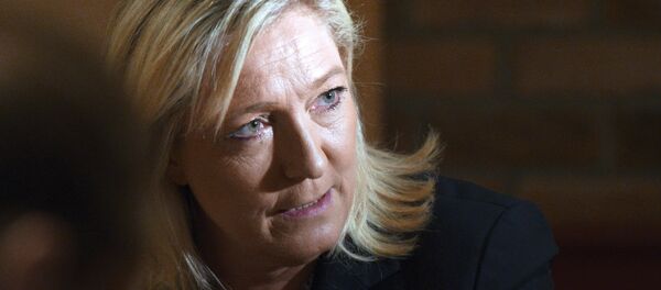 Head of the Front National far-right party Marine Le Pen gives a press conference to announce her candidacy for the regional elections in the Nord-Pas-de-Calais region, on June 30, 2015 in Arras. AFP PHOTO / DENIS CHARLET - Sputnik Afrique