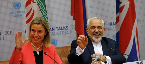 High Representative of the European Union for Foreign Affairs and Security Policy Federica Mogherini and Iranian Foreign Minister Mohammad Javad Zarif (R) react during a plenary session at the United Nations building in Vienna, Austria July 14, 2015. - Sputnik Afrique