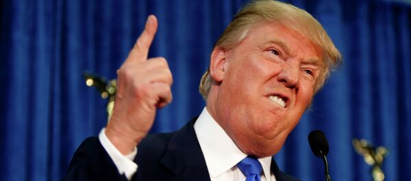 Republican presidential candidate Donald Trump gestures and declares You're fired! at a campaign rally in Manchester, New Hampshire, in this file photo taken June 17, 2015. - Sputnik Afrique