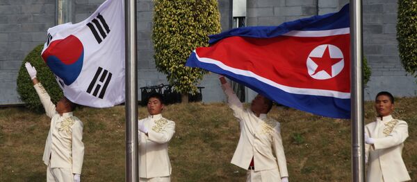 The flags of South Korea and China - Sputnik Afrique