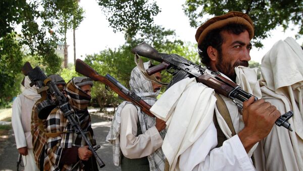 Taliban fighters hold their heavy and light weapons before surrendering them to Afghan authorities in Jalalabad, east of Kabul, Afghanistan. File photo - Sputnik Afrique