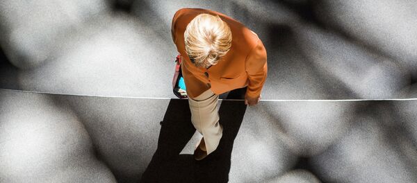 German chancellor Angela Merkel leaves after a session at the Bundestag lower house of parliament on the Greek crisis on July 1, 2015 in Berlin - Sputnik Afrique