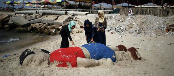 Sculpture de sable représentant le garçon syrien Aylan Kurdi, Gaza - Sputnik Afrique