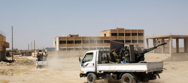 Des militaires syriens dans une rue de la ville d'Hassaké (est de la Syrie) - Sputnik Afrique