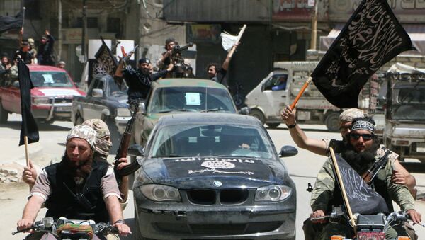 Fighters from Al-Qaeda's Syrian affiliate Al-Nusra Front drive in the northern Syrian city of Aleppo. (File) - Sputnik Afrique