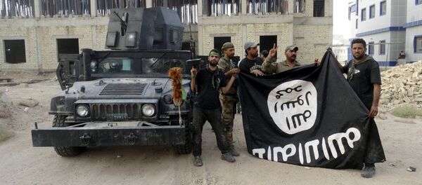 Des combattants du groupe terroriste Etat islamique - Sputnik Afrique