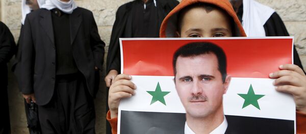 Le portait du président syrien Bachar al-Assad - Sputnik Afrique