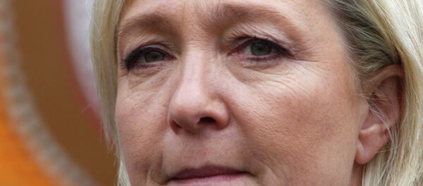 French far-right leader and National Front Party, Marine Le Pen, exits the polling station as she goes to vote for the first round of local elections, Sunday, March 22, 2015, in Henin-Beaumont, northern France. - Sputnik Afrique