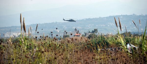 Российский вертолет Ми-24 патрулирует окрестности авиабазы Хмеймим - Sputnik Afrique