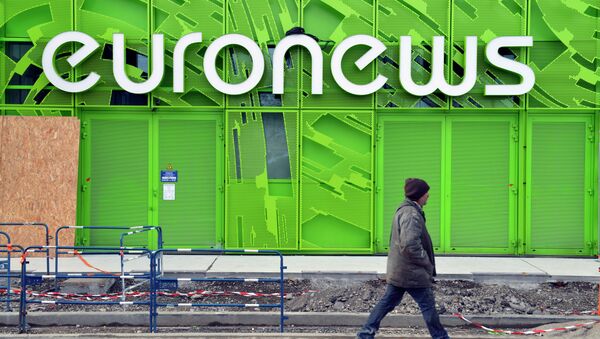 A photo taken on February 6, 2014 shows a man walking past the Euronews building in Lyon's new Confluence district - Sputnik Afrique