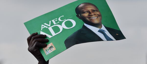 Un partisan du président Alassane Ouattara Côte-d'Ivoire - Sputnik Afrique