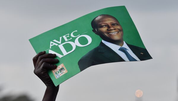 Un partisan du président Alassane Ouattara Côte-d'Ivoire - Sputnik Afrique