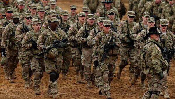 Members of the US Army B Company, 2nd Battalion, 8th Cavalry Regiment, 1st Brigade Combat Team, 1st Cavalry Division attend a military exercise 'Iron Sword 2014', at the Gaiziunu Training Range in Pabrade some 60km.(38 miles) north of the capital Vilnius, Lithuania - Sputnik Afrique